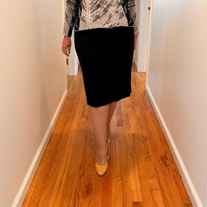 Eileen Fisher black knit below the knee skirt with one side slit